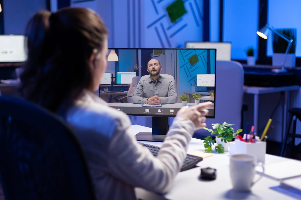 Busniess woman disscusing custom serivices problem on videocall during online meeting. Employee working late on desk studio at financel strategy using technology network wireless